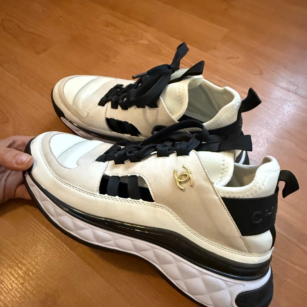 CHANEL Cream and Black Sneakers with Gold Accent